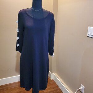 Black dress with white bows on arms